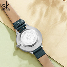 green leather strap watch